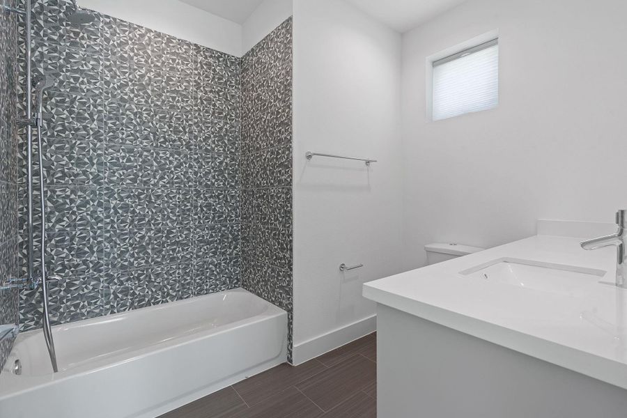 En-suite bathroom for main level bedroom.