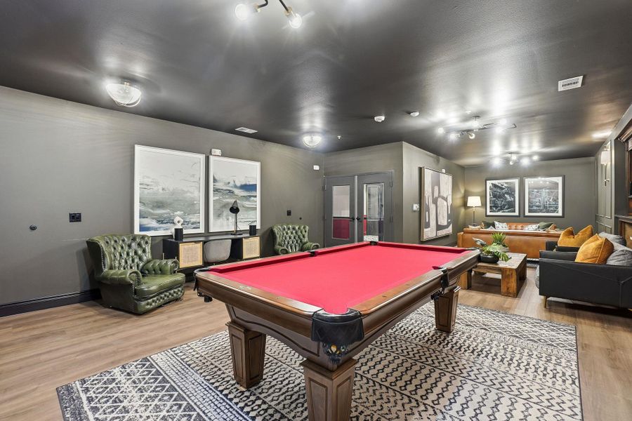 Rec room featuring pool table and light wood-style flooring