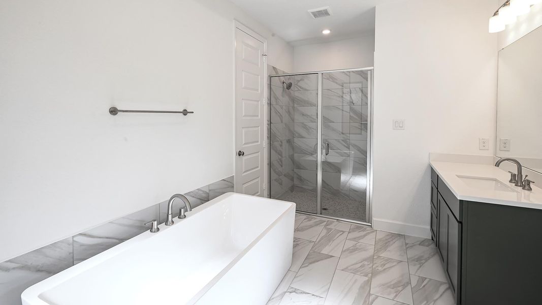 Furnished interior view inside a new home in 6 Creeks 50', Kyle (Image 13).