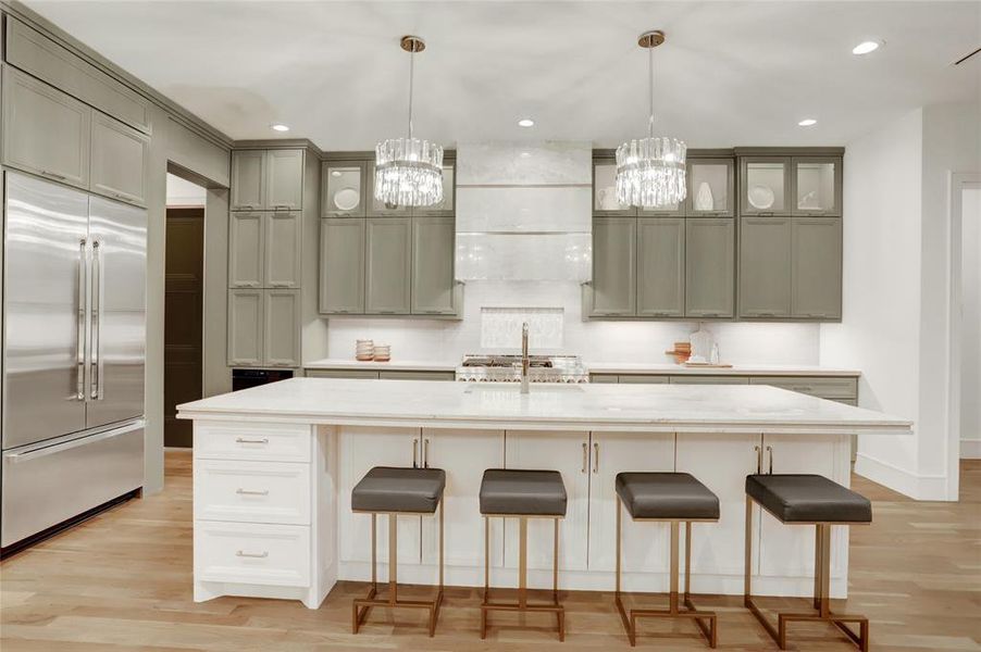 The kitchen boasts 10 foot island with triple laminated, stone, detail, and door storage on both sides plus under knee space cabinets for overflow.