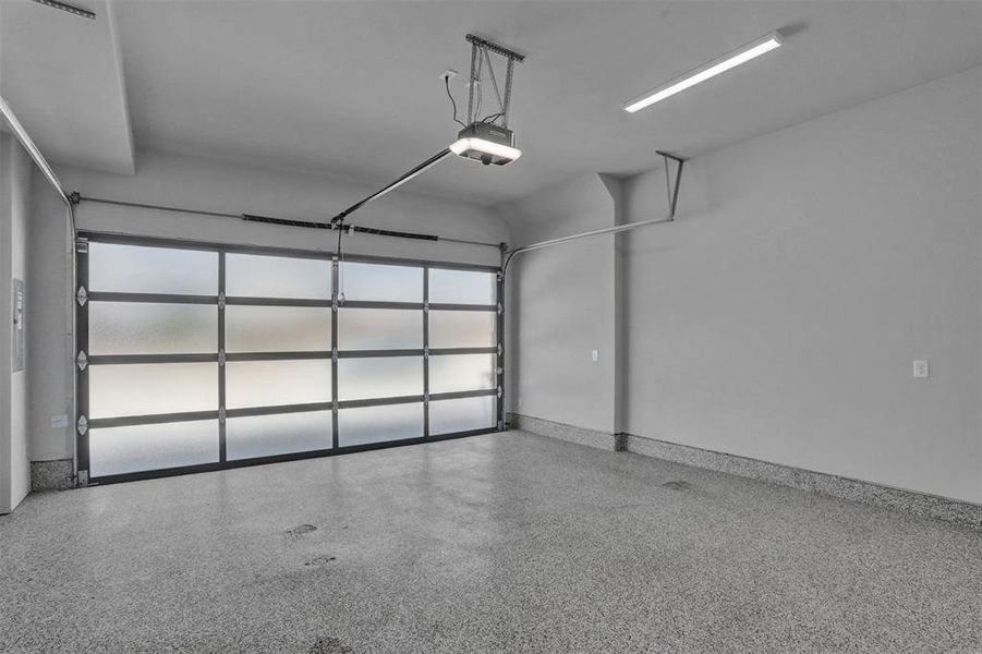 Two car garage with epoxy finish on the floor. Additional space at front of garage for storage. Two car garage with epoxy finish on the floor. Additional space at front of garage for storage.
