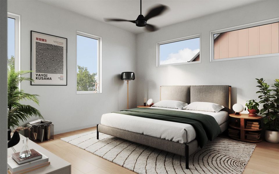 Bedroom with multiple windows providing abundant light