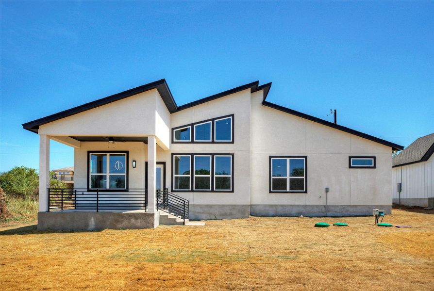 Dramatic rooflines and crisp white stucco define this modern architectural exterior. Dramatic rooflines and crisp white stucco define this modern architectural exterior.