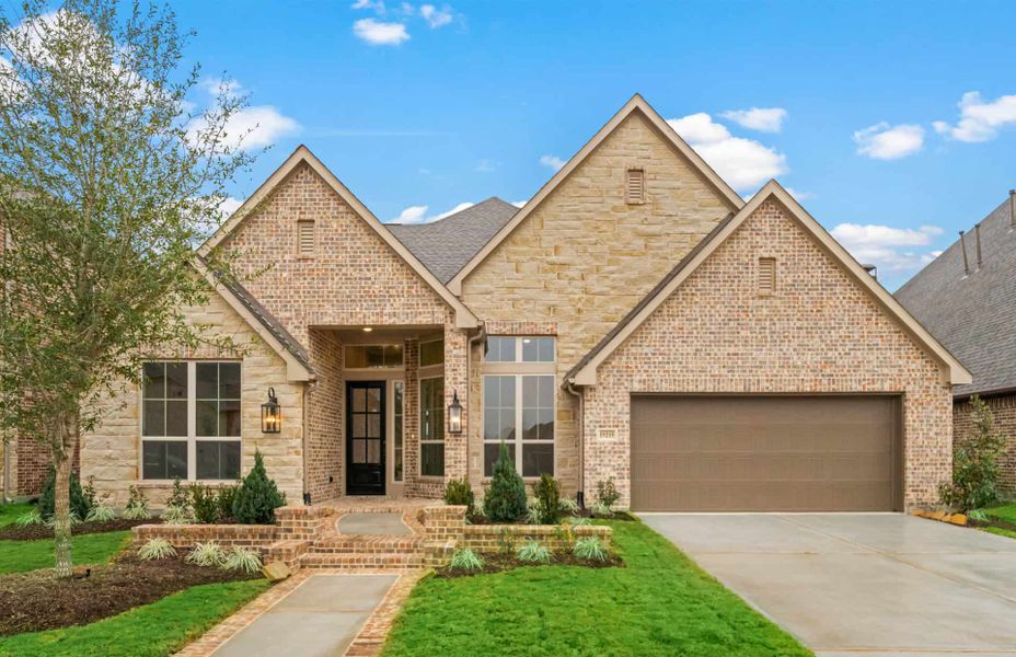 Representative exterior photo of a completed home built from the 3326 by Ravenna Homes in Cross Creek West, Fulshear, TX (Image 27).