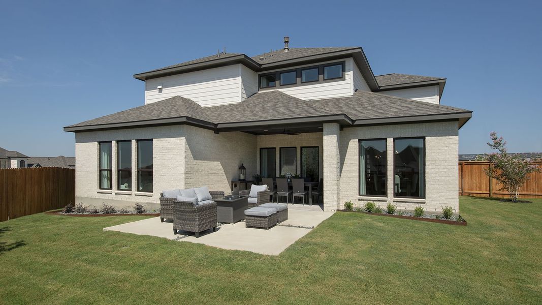 Front exterior of a new home in Weston Oaks 55', San Antonio, TX, highlighting curb appeal (Image 2). Front exterior of a new home in Weston Oaks 55', San Antonio, TX, highlighting curb appeal (Image 2).