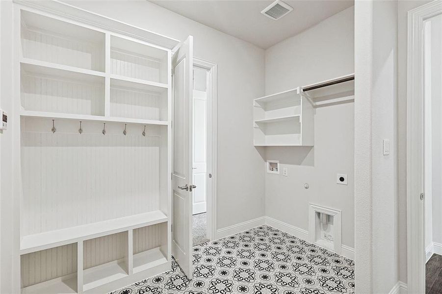 Clothes washing area featuring hookup for an electric dryer, gas dryer hookup, and washer hookup