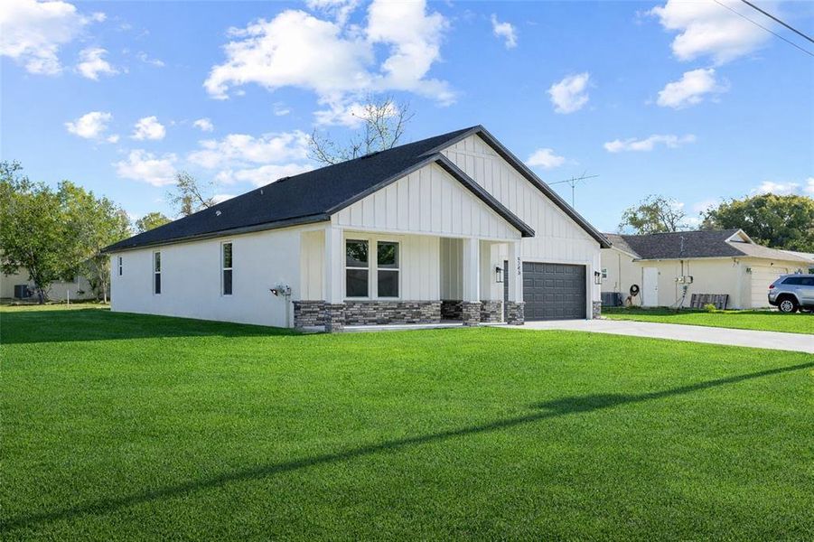Front exterior of a new home in , Spring Hill, FL, highlighting curb appeal (Image 22).