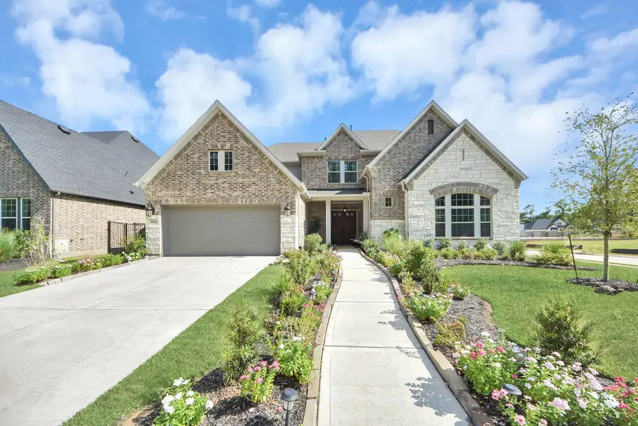 Front exterior of a new home in , Missouri City, TX, highlighting curb appeal (Image 25). Front exterior of a new home in , Missouri City, TX, highlighting curb appeal (Image 25).