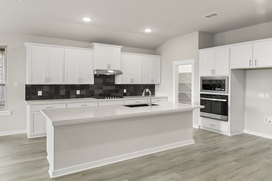 Representative furnished interior of a home built from the Hickory Sunterra 50s by Brohn Homes in Sunterra, Katy (Image 3).