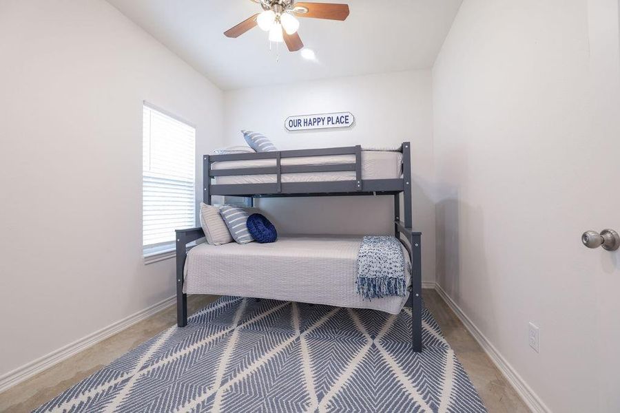 Bedroom featuring baseboards and a ceiling fan