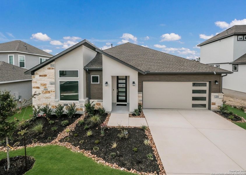 Front exterior of a new home in Esperanza, Boerne, TX, highlighting curb appeal (Image 1).