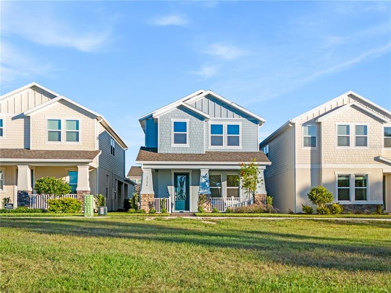 Front exterior of a new home in , Winter Garden, FL, highlighting curb appeal (Image 22).
