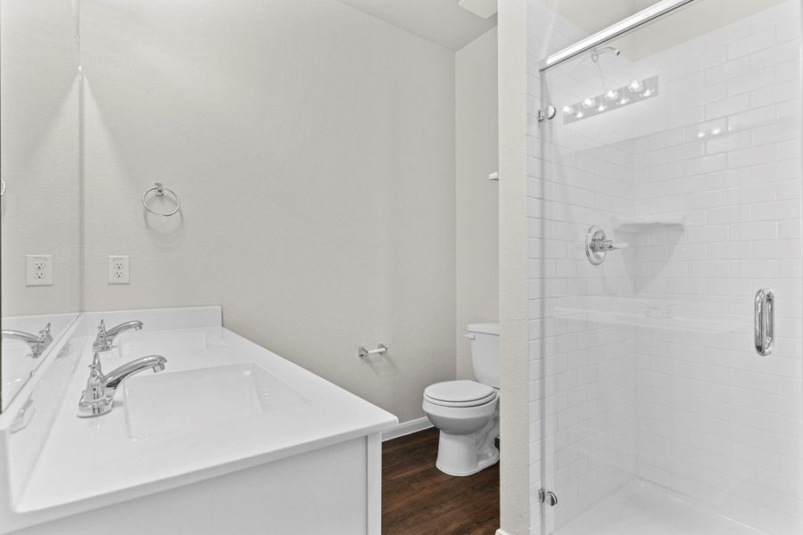 Spa-inspired primary bath featuring his and her private sinks, sleek countertops, and a large walk-in shower with modern finishes—creating a clean and relaxing space to start or end your day. Take that long, long hot shower you will not run out of hot water with the Tankless/On-Demand H2O Heater! Spa-inspired primary bath featuring his and her private sinks, sleek countertops, and a large walk-in shower with modern finishes—creating a clean and relaxing space to start or end your day. Take that long, long hot shower you will not run out of hot water with the Tankless/On-Demand H2O Heater!