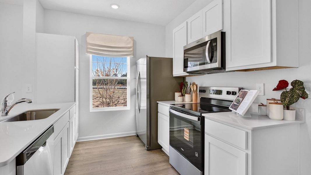 Representative furnished interior of a home built from the Baxter by D.R. Horton in Liberty Cove, Yulee (Image 11).