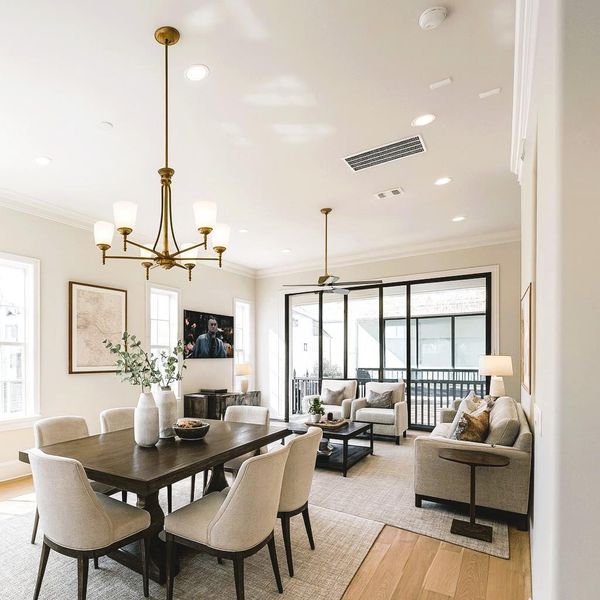 12 FT Living Room Ceilings - Brings in So Much Light! 10 FT Tall  3 Paneled Sliding Glass Doors Open to a Fantastic Walkout Balcony