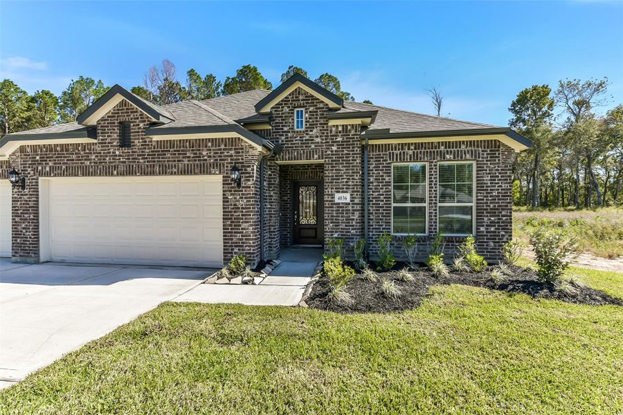 Front exterior of a new home in Encino Estates, Dayton, TX, highlighting curb appeal (Image 19).