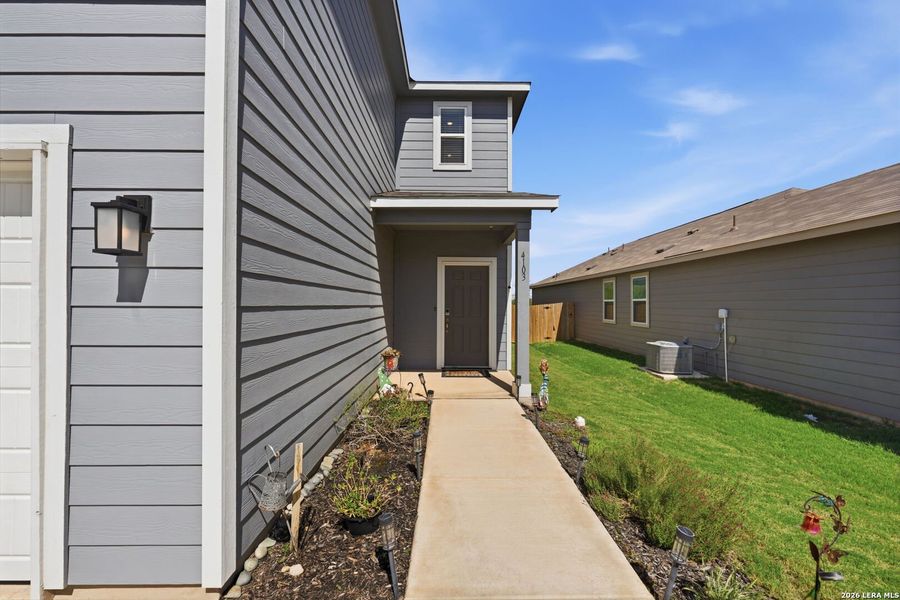 Exterior details and patio area of a home in Millican Grove, Converse (Image 27).
