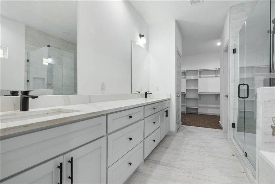 Bathroom with vanity and an enclosed shower