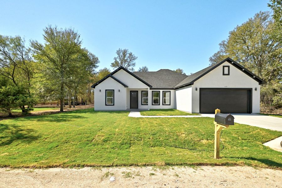 Front exterior of a new home in , Bastrop, TX, highlighting curb appeal (Image 25). Front exterior of a new home in , Bastrop, TX, highlighting curb appeal (Image 25).