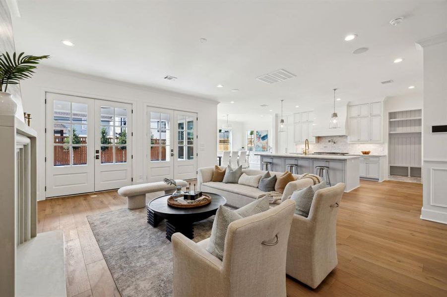 Additional view of family room open to the kitchen. This home is complete with Smart Enabled Technology via the Control 4 system which includes all lighting, thermostats, alarm and security camera system, sound and more. Prewired with CAT 6 networking/cable throughout!