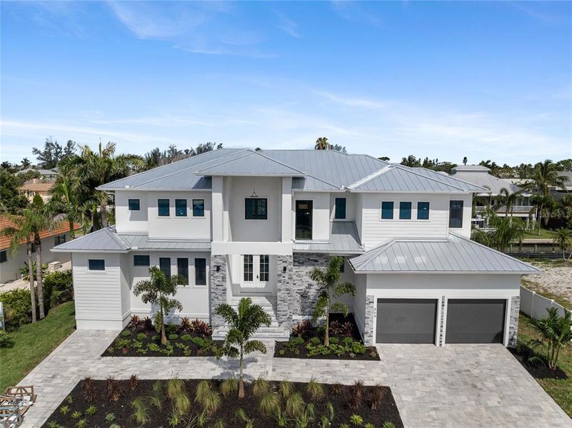 Front exterior of a new home in , Longboat Key, FL, highlighting curb appeal (Image 30). Front exterior of a new home in , Longboat Key, FL, highlighting curb appeal (Image 30).