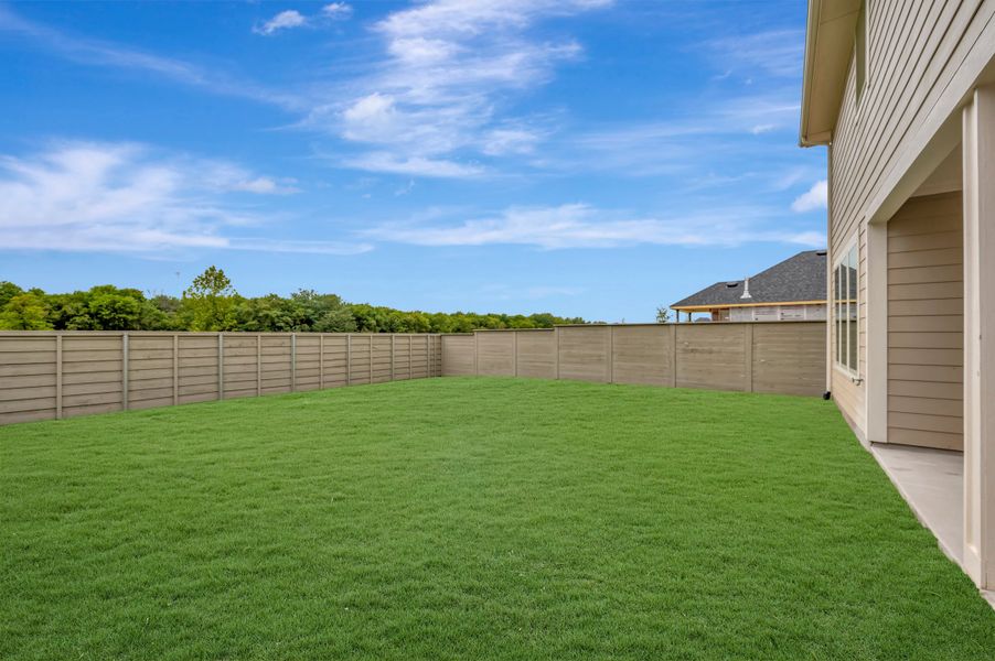 Exterior details and patio area of a home in Treeline, Justin (Image 16).