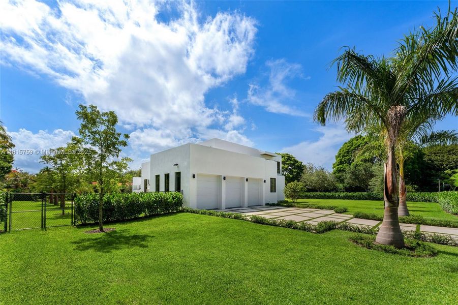 Front exterior of a new home in , Pinecrest, FL, highlighting curb appeal (Image 1).