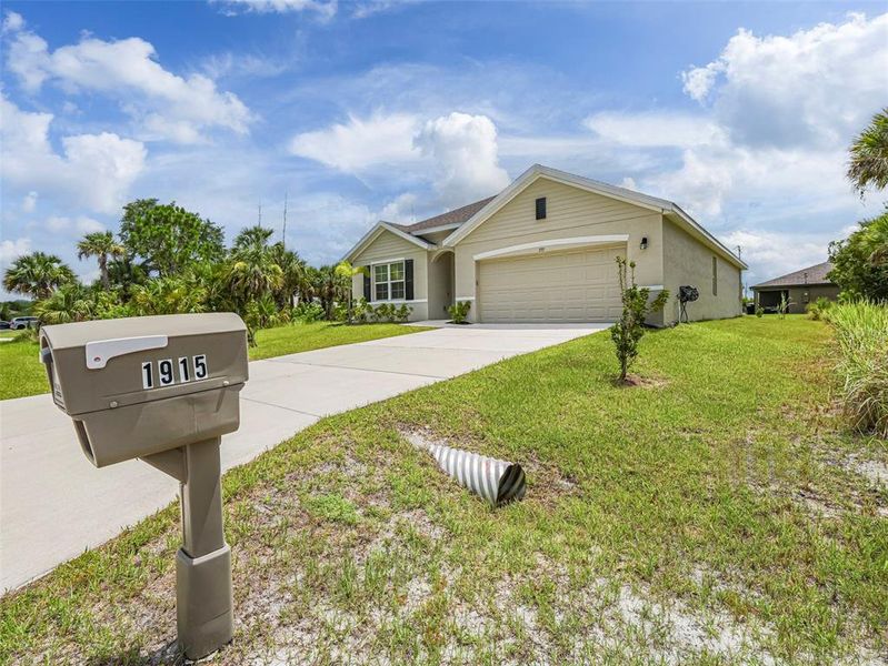 Front exterior of a new home in , Palm Bay, FL, highlighting curb appeal (Image 23). Front exterior of a new home in , Palm Bay, FL, highlighting curb appeal (Image 23).