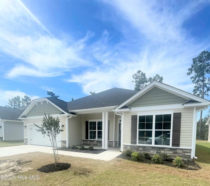 Front exterior of a new home in Athens Acres, New Bern, NC, highlighting curb appeal (Image 1).