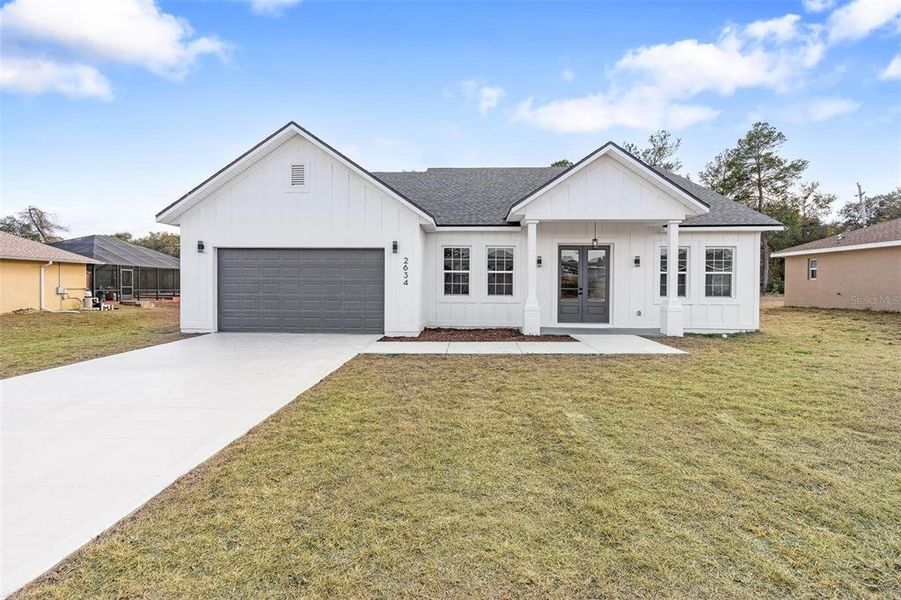 Front exterior of a new home in , Ocala, FL, highlighting curb appeal (Image 18).