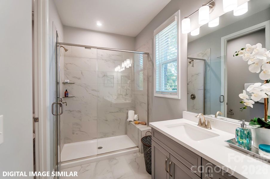 PRIMARY BEDROOM EN SUITE (MAIN LEVEL) - Photo is for representation purposes of floorplan only - colors, finishes, and options will vary