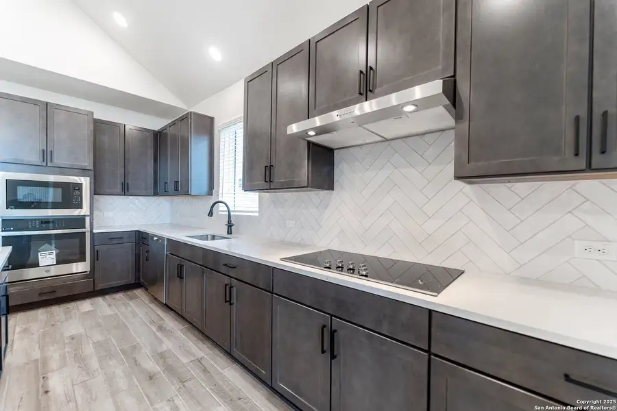 Furnished interior view inside a new home in The Woodlands at Medina Hills, Mico (Image 4).