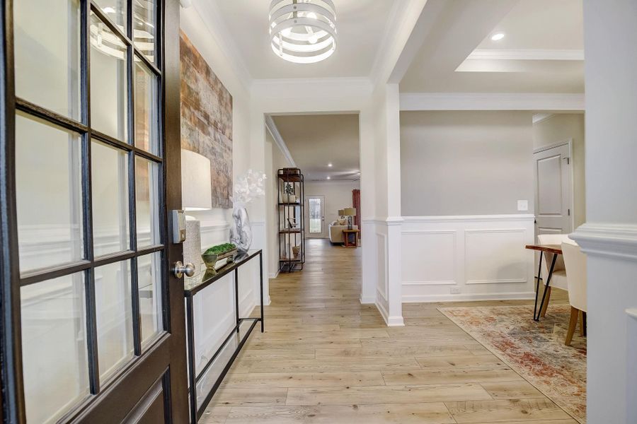 The Palmer- Foyer into the Dining Room. The sample image is a staged model, to be used for illustrative purposes only. Upgrades, options, and colors will vary. The Palmer- Foyer into the Dining Room. The sample image is a staged model, to be used for illustrative purposes only. Upgrades, options, and colors will vary.
