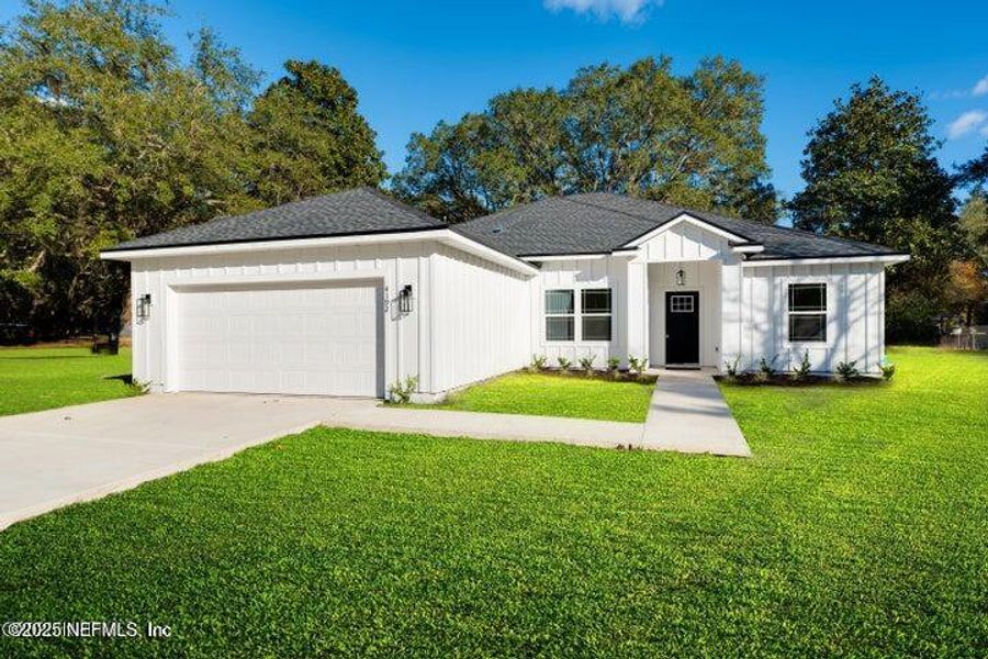 Front exterior of a new home in , Middleburg, FL, highlighting curb appeal (Image 1). Front exterior of a new home in , Middleburg, FL, highlighting curb appeal (Image 1).