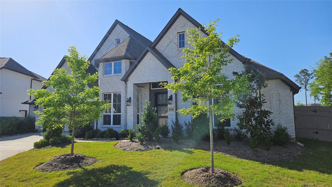 Front exterior of a new home in , Conroe, TX, highlighting curb appeal (Image 24). Front exterior of a new home in , Conroe, TX, highlighting curb appeal (Image 24).