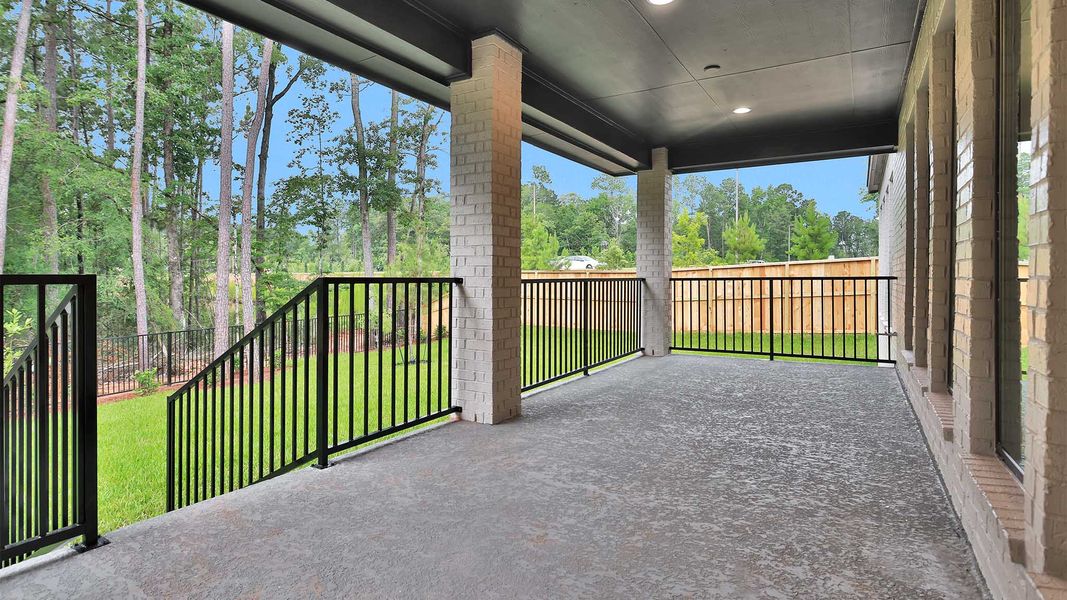 Exterior details and patio area of a home in The Woodlands Hills, Willis (Image 3).