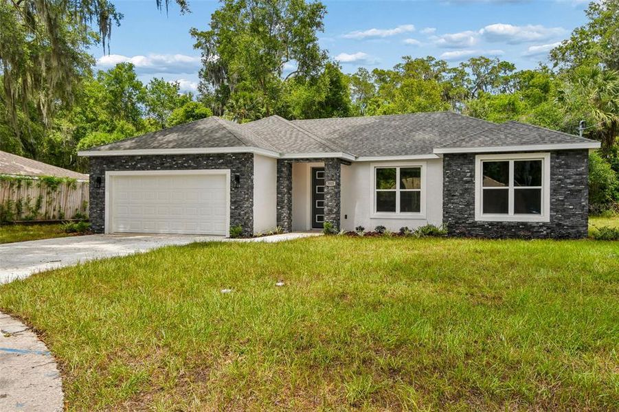 Front exterior of a new home in , Deland, FL, highlighting curb appeal (Image 23).
