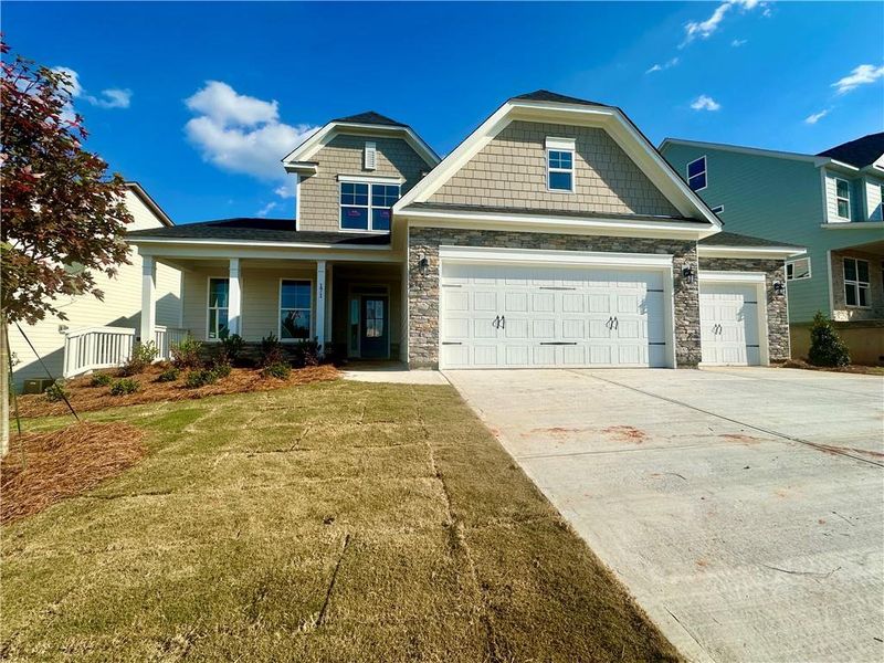 Front exterior of a new home in Twin Lakes, Hoschton, GA, highlighting curb appeal (Image 1).