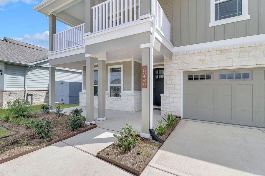 Your covered front porch beckons, offering a cozy spot to relax with a morning coffee or wave to neighbors as they stroll by.