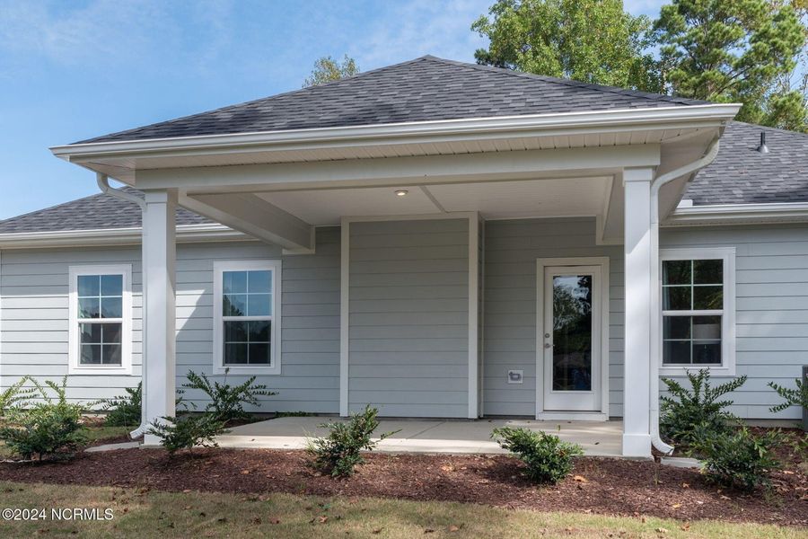 Front exterior of a new home in River Village Square in River Landing, Wallace, NC, highlighting curb appeal (Image 2). Front exterior of a new home in River Village Square in River Landing, Wallace, NC, highlighting curb appeal (Image 2).
