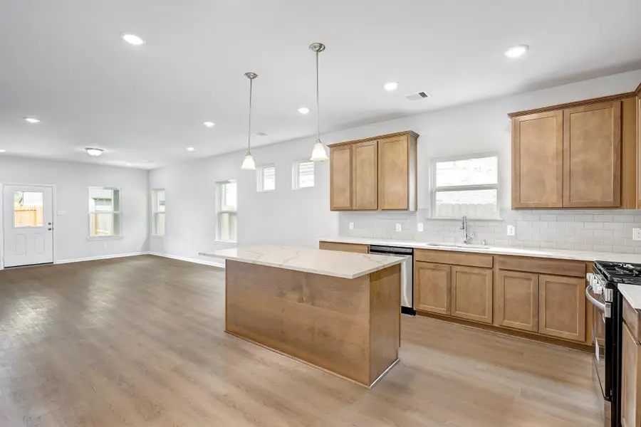 The Davenport II- Kitchen into the Dining Area and Family Room. Sample floor plan photo used for illustrative purposes only. Upgrades, selections options, and colors will vary. The Davenport II- Kitchen into the Dining Area and Family Room. Sample floor plan photo used for illustrative purposes only. Upgrades, selections options, and colors will vary.
