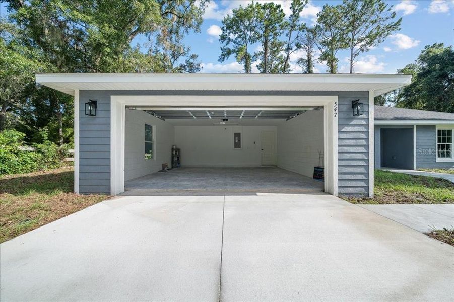 Front exterior of a new home in , Dunnellon, FL, highlighting curb appeal (Image 20).