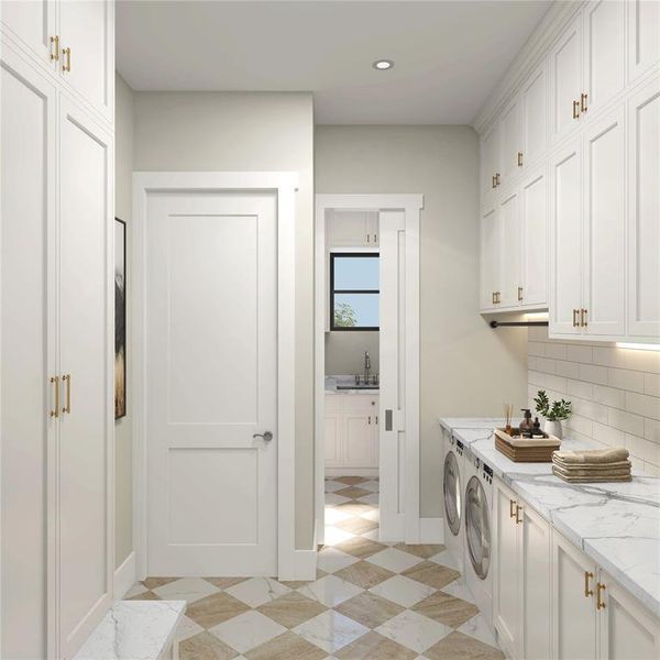 Downstairs laundry/mud room directly coming in from the garage. Additional floor to ceiling cabinetry for all of your necessary storage.