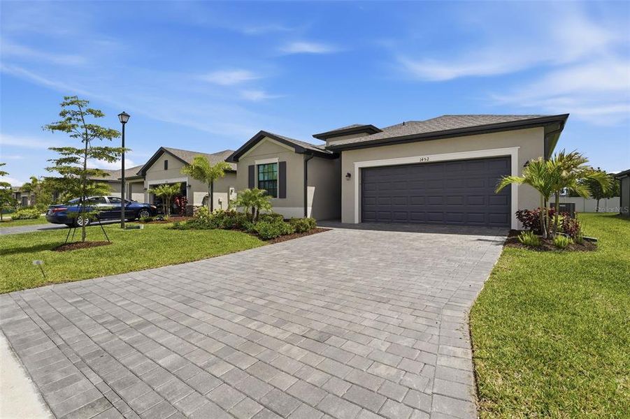 Front exterior of a new home in , Port Charlotte, FL, highlighting curb appeal (Image 23).