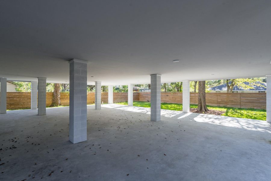 Oversized garage has rear access to this sprawling 50x40' covered patio—ideal for extra parking or boat storage. This space also offers utility connections for future outdoor kitchen installation. Oversized garage has rear access to this sprawling 50x40' covered patio—ideal for extra parking or boat storage. This space also offers utility connections for future outdoor kitchen installation.