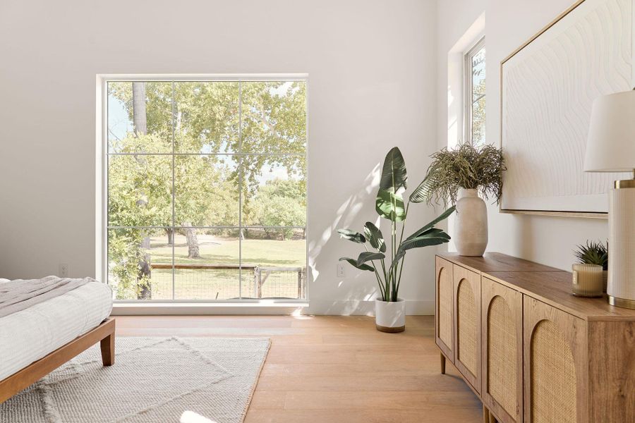 Bedroom featuring light wood-style flooring Bedroom featuring light wood-style flooring