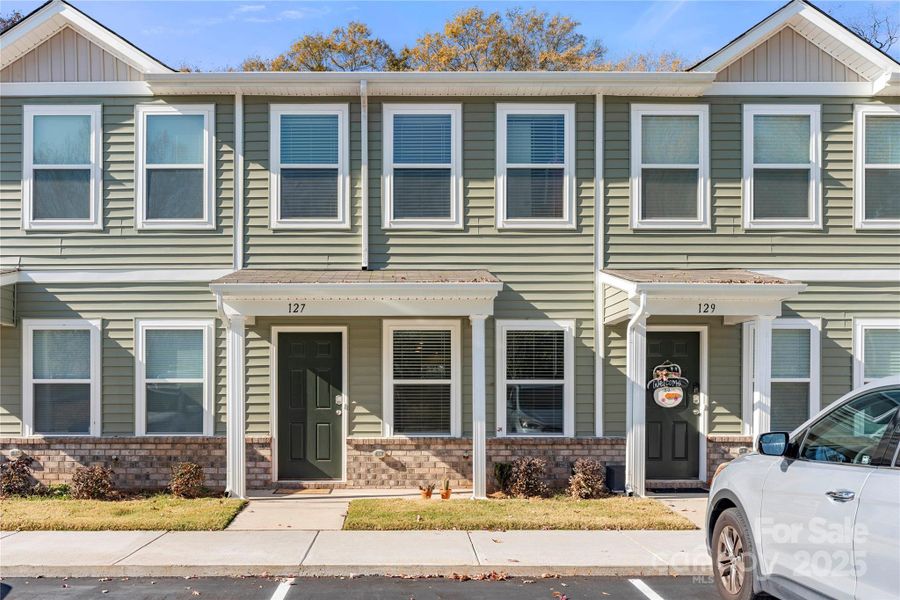 Front exterior of a new home in , Lincolnton, NC, highlighting curb appeal (Image 1).