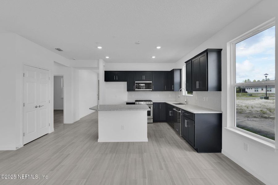 Furnished interior view inside a new home in Del Webb Wildlight, Yulee (Image 11).