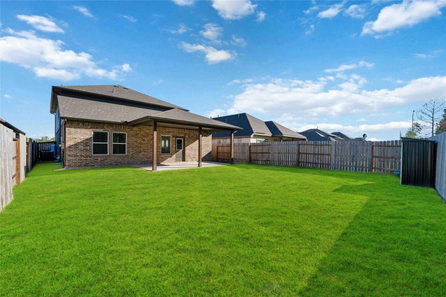 The fully fenced backyard includes fresh sod, wood privacy fencing, and no back neighbors for added tranquility. The fully fenced backyard includes fresh sod, wood privacy fencing, and no back neighbors for added tranquility.