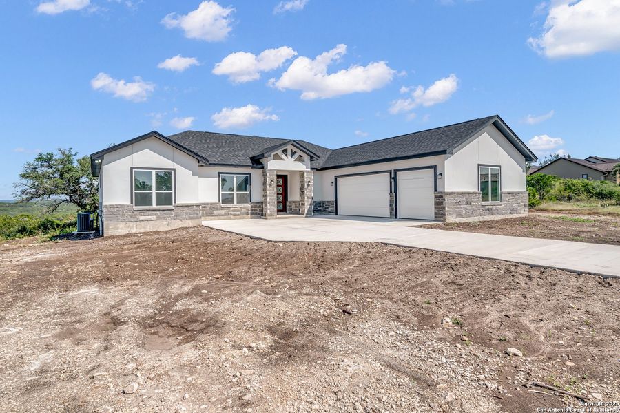 Front exterior of a new home in , Mico, TX, highlighting curb appeal (Image 17). Front exterior of a new home in , Mico, TX, highlighting curb appeal (Image 17).